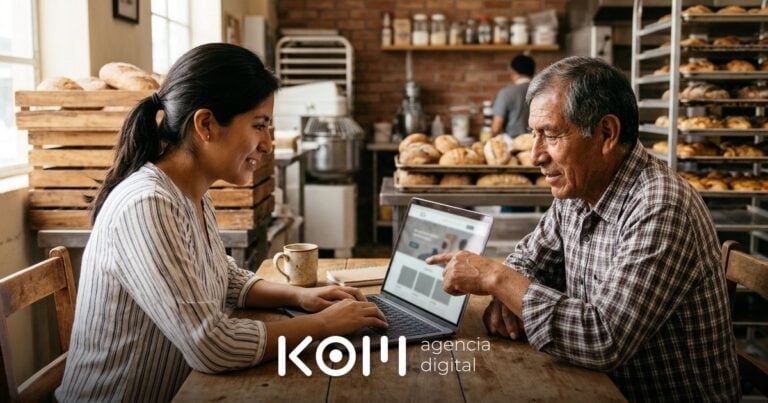 Emprendedora y su padre revisan en la laptop cómo crear una página web con IA para su panadería familiar (crear página web con ia)