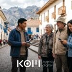 Guía cusqueño conversa con viajeros extranjeros que revisan en el celular un tour reservado por Google Ads para turismo (google ads turismo)