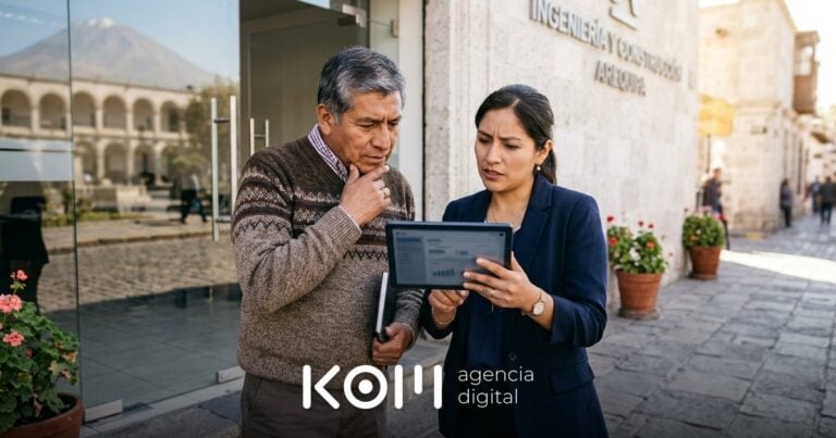 Socios de una empresa de Arequipa revisan en una tablet cómo la IA describe su marca y planean su desambiguación de marca (desambiguación de marca ia)